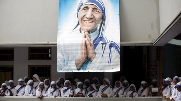 Catholic nuns from the order of the Missionaries of Charity gather under a picture of Mother Teresa during the tenth anniversary of her death in Kolkata, India, (2007 file pic)