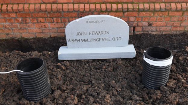 John Edwards under his 'grave'
