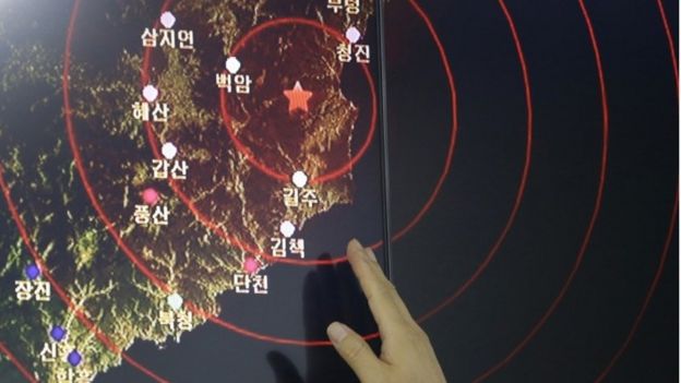 In this Friday, Sept. 9, 2016, file photo, an official of the Earthquake and Volcano of the Korea Monitoring Division points at the epicentre of seismic waves in North Korea, in Seoul, South Korea.