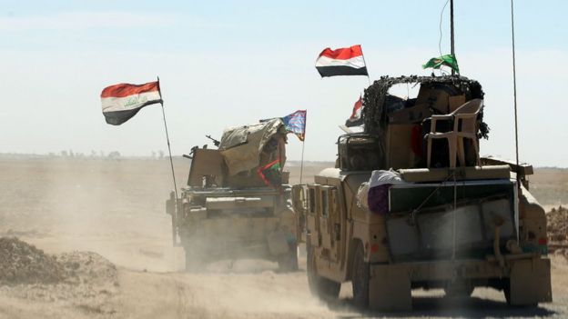 Iraqi forces gather at the Qayyarah military base near Mosul