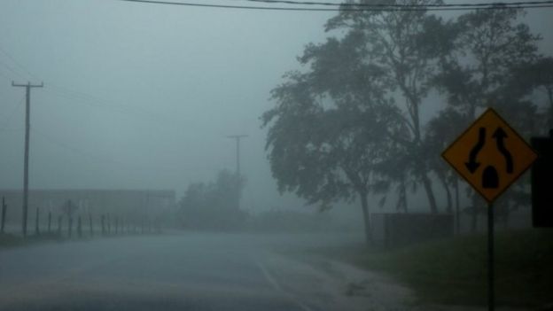 Heavy rain is pictured through the windshield of a car as Hurricane Earl approaches in Belize City (03 August 2016)