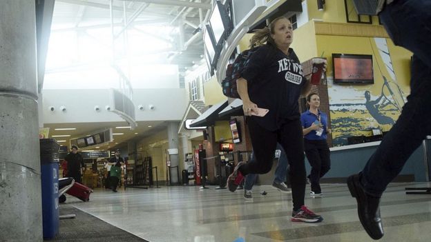 Passengers run for cover in Terminal 1 at Fort Lauderdale's 
