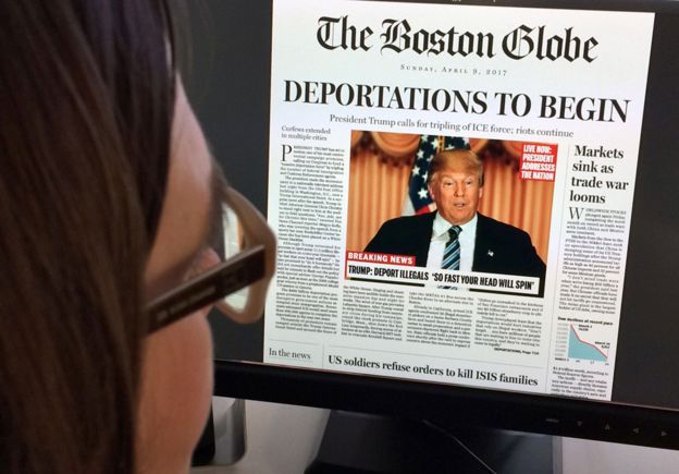 Woman reads mock-up of what a front page might look like should Republican frontrunner Donald Trump win the presidency