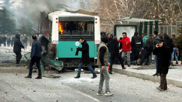 People react after a bus was hit by an explosion in Kayseri, Turkey, December 17, 2016.