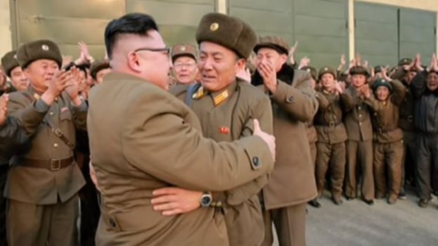 Picture of Kim Jong-un embracing a military officer in a photo released on 19 March 2017