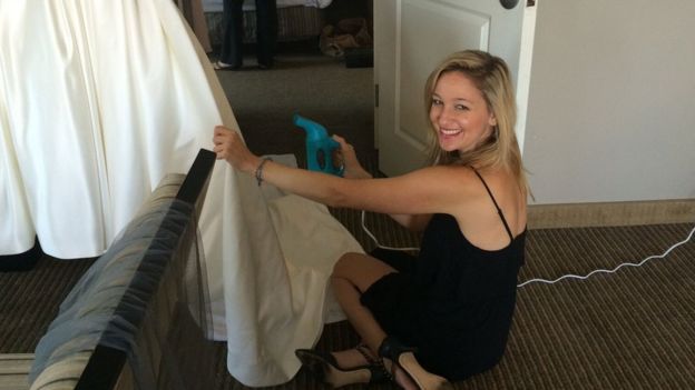 Jen Glantz steaming a wedding dress