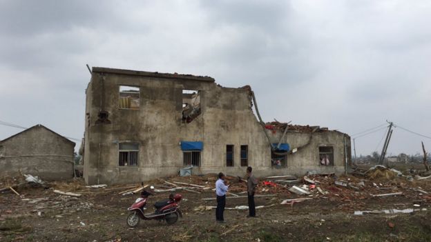 A damaged home in Xintu village