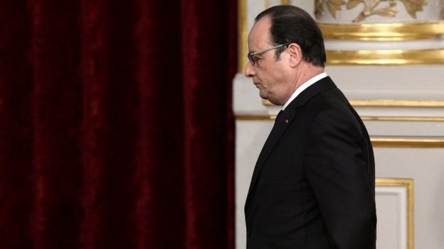 Francois Hollande leaves after commenting on his decision to drop plans to change the constitution