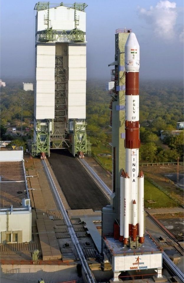 A handout photo made available by the Indian Space Research Organization (ISRO) on 15 February 2017 shows the fully integrated PSLV-C37 seen with a Mobile Service Tower at the Satish Dhawan Space Centre in Sriharikota, Andhra Pradesh, India, 13 February 2017