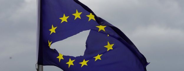 A European Union flag, with a hole cut in the middle, flies at half-mast outside a home in Knutsford Cheshire - 24 June 2016