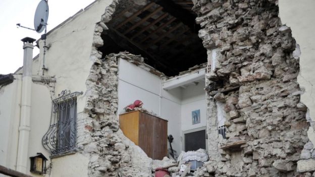 A building is badly damaged after an earthquake in Italy