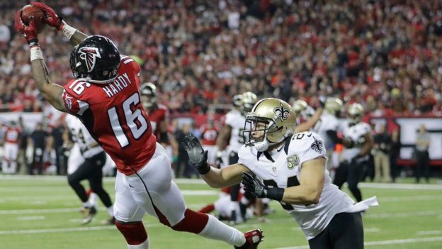 Atlanta Falcons wide receiver Justin Hardy (16) makes a touchdown catch against New Orleans Saints cornerback Sterling Moore (24) during the first half of an NFL football game, Sunday, Jan. 1, 2017, in Atlanta.