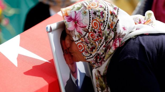 Relatives of Umut Sakaroglu, a custom officer at Ataturk Airport who was killed in the attacks on 28 June, mourn during a funeral in Istanbul, Turkey, 29 June 2016.