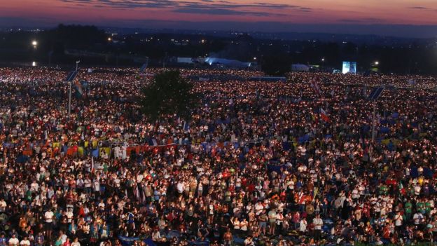 Pilgrims attending World Youth Day 2016 attend an evening vigil with Pope Francis at the Campus Misericordiae in Brzegi, near Krakow, Poland, Saturday, July 30 2016.