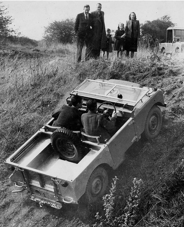 Series One Land Rover in 1949 being driven up a hill