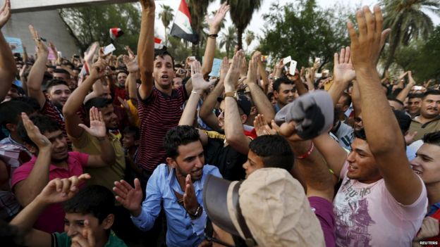 Iraqis shout slogans during a demonstration against power cuts amid an intense heatwave at Tahrir Square in central Baghdad, Iraq, July 31,