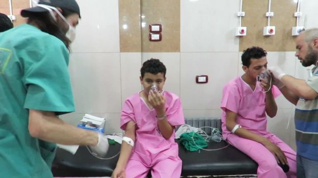 UGC image shows civilians in hospital gowns with breathing masks, reportedly after a Chlorine attack in a suburb of Aleppo, Tuesday 6 September 2016