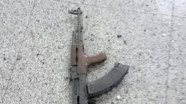 A Kalashnikov assault rifle is seen on the floor at Ataturk airport