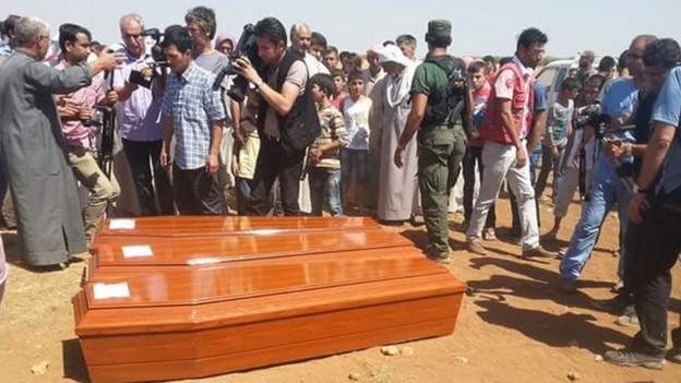 Coffins bearing the bodies of Alan Kurdi and other members of his family