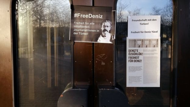 A sign for the arrested journalist Deniz Yuecel