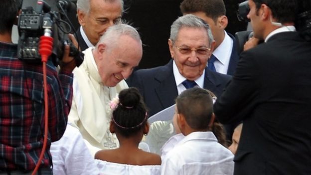 Pope Francis is welcomed by Cuban President Raul Castro upon landing at Havana