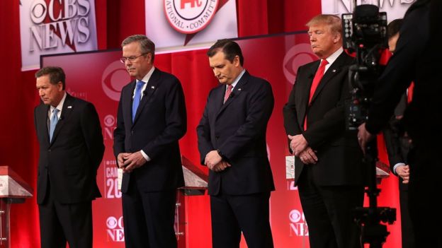 Republican presidential candidates (L-R) Ohio Governor John Kasich, Jeb Bush, Sen. Ted Cruz (R-TX) and Donald Trump observe a moment of silence for U.S. Supreme Court Justice Antonin Scalia,