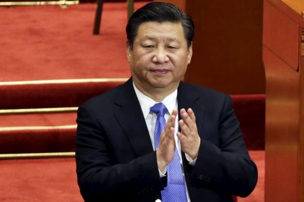 China's President Xi Jinping claps during the closing ceremony of the Chinese People