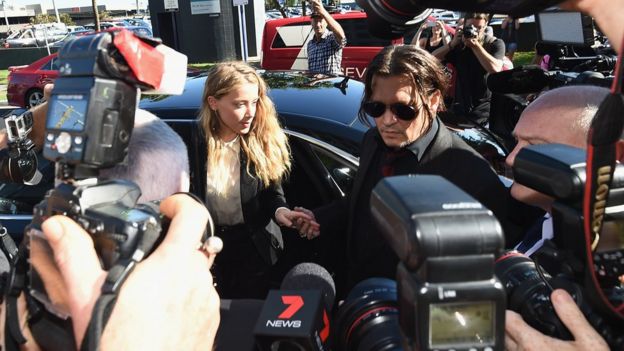 Actors Johnny Depp and Amber Heard faced a huge media contingent when they arrived at court on Monday