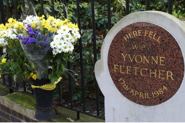 Flowers beside the memorial plaque for Yvonne Fletcher