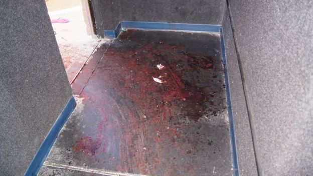 Blood at an exit of the cinema after the shooting