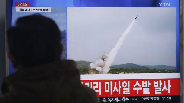 Man watches TV footage of missile launch conducted by North Korea, at Seoul Railway Station, South Korea, Thursday, March 3, 2016