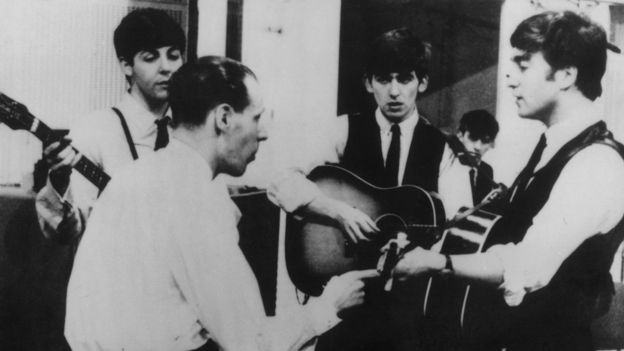 The Beatles in the studio with George Martin