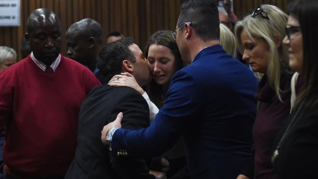 Oscar Pistorius hugs his sister Aimee as he leaves the High Court in Pretoria, South Africa on 6 July