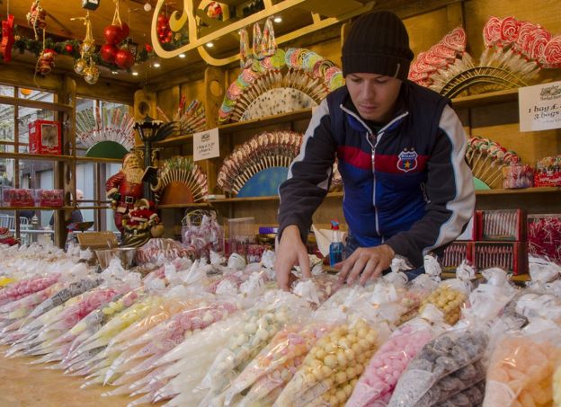 Christian Lus arranging sweets