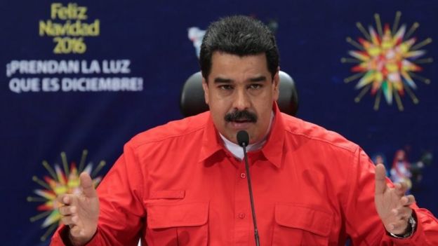 A handout picture provided by the press office of the Miraflores presidential palace shows the President of Venezuela Nicolas Maduro speaking during an official event in Caracas, Venezuela, 11 December 2016.