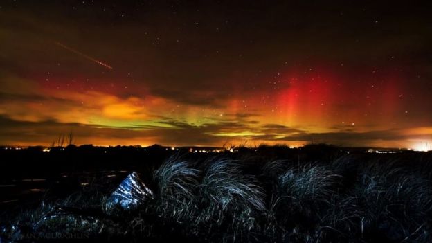 Fiery reds and oranges were seen over Ballynamona beach in County Cork, Ireland, as photographed by Ronan McLaughlin