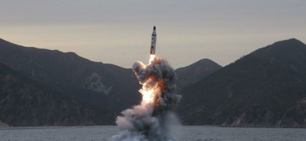 Undated image released by North Korea purporting to show a submarine missile launch