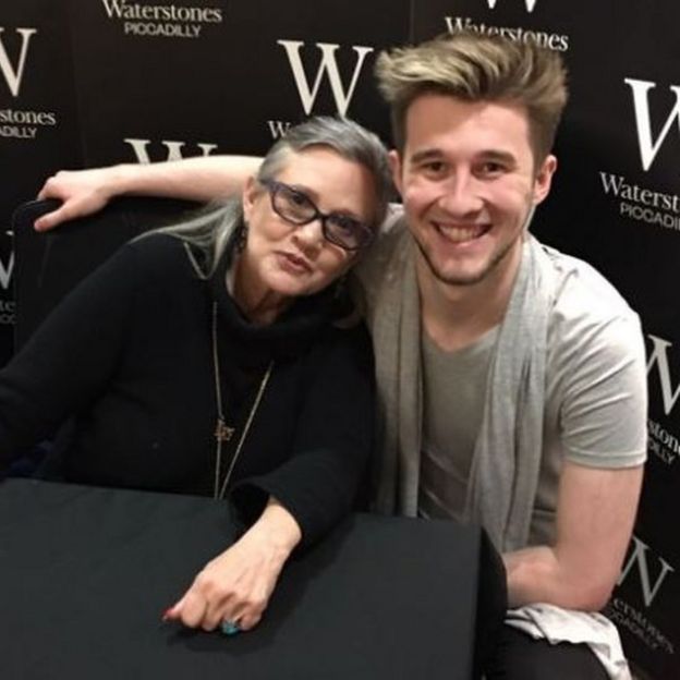 Photo of John Moore at a book signing with Carrie Fisher
