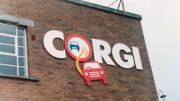 Corgi logo on the side of the brick building