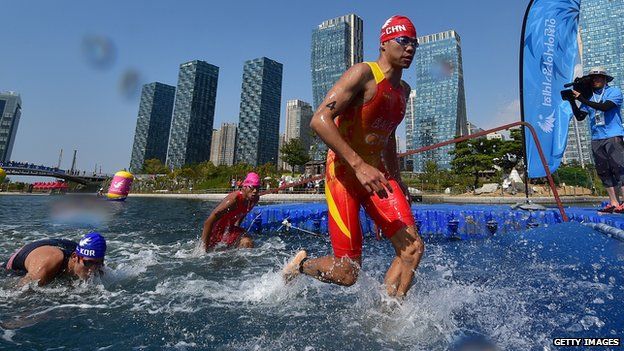 China's Bai Faquan competing in a triathlon