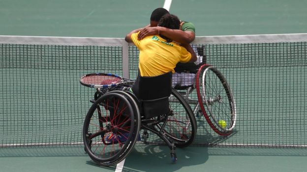 Lucas Sithole of South Africa and Ymanitu Silva of Brazil celebrate together after competing in the wheelchair tennis at central court on day 3 of the Rio 2016 Paralympics on September 10, 2016 in Rio de Janeiro, Brazil.