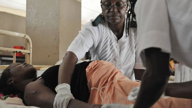 Nurses attending to a pregnant women in Sierra Leone