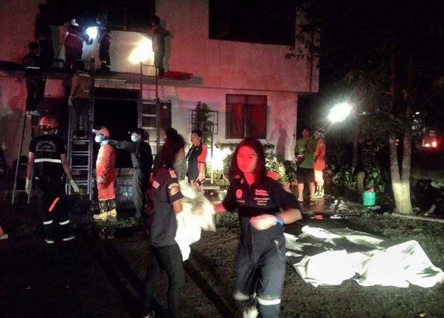 Firefighters tackle the fire at Pithakkiart Witthaya school in Chiang Rai, Thailand (22 May 2016)