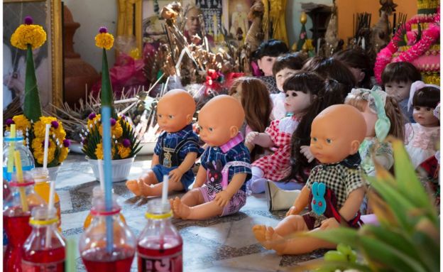 Dolls sat in a room at a temple