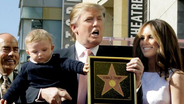 In this Jan. 16, 2007 file photo, Donald Trump, with his wife, Melania Trump, and their son, Barron