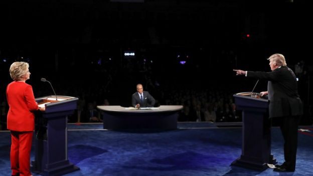 Republican presidential nominee Donald Trump points toward Democratic presidential nominee Hillary Clinton during the presidential debate at Hofstra University in Hempstead, N.Y., Monday, 26 September 2016.