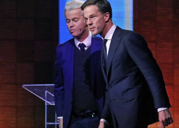 Mark Rutte (right) and Geert Wilders leave after a national televised debate at Erasmus University in Rotterdam, Netherlands, 12 March
