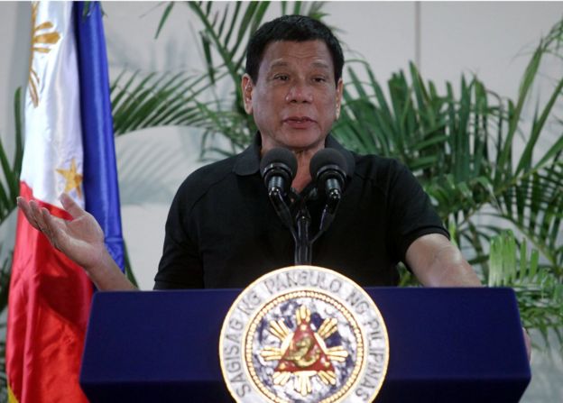 Philippines President Rodrigo Duterte gestures during a news conference at the International Airport in Davao city, Philippines on September 30, 2016.