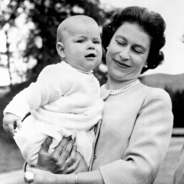 Queen Elizabeth II holding Prince Andrew during an outing in the grounds at Balmoral, Scotland