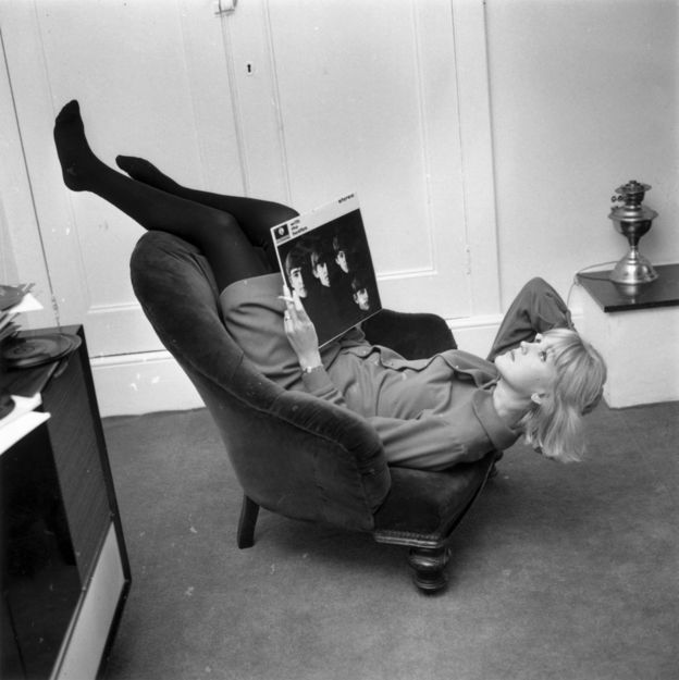 Annie Nightingale relaxing with a Beatles album in 1964